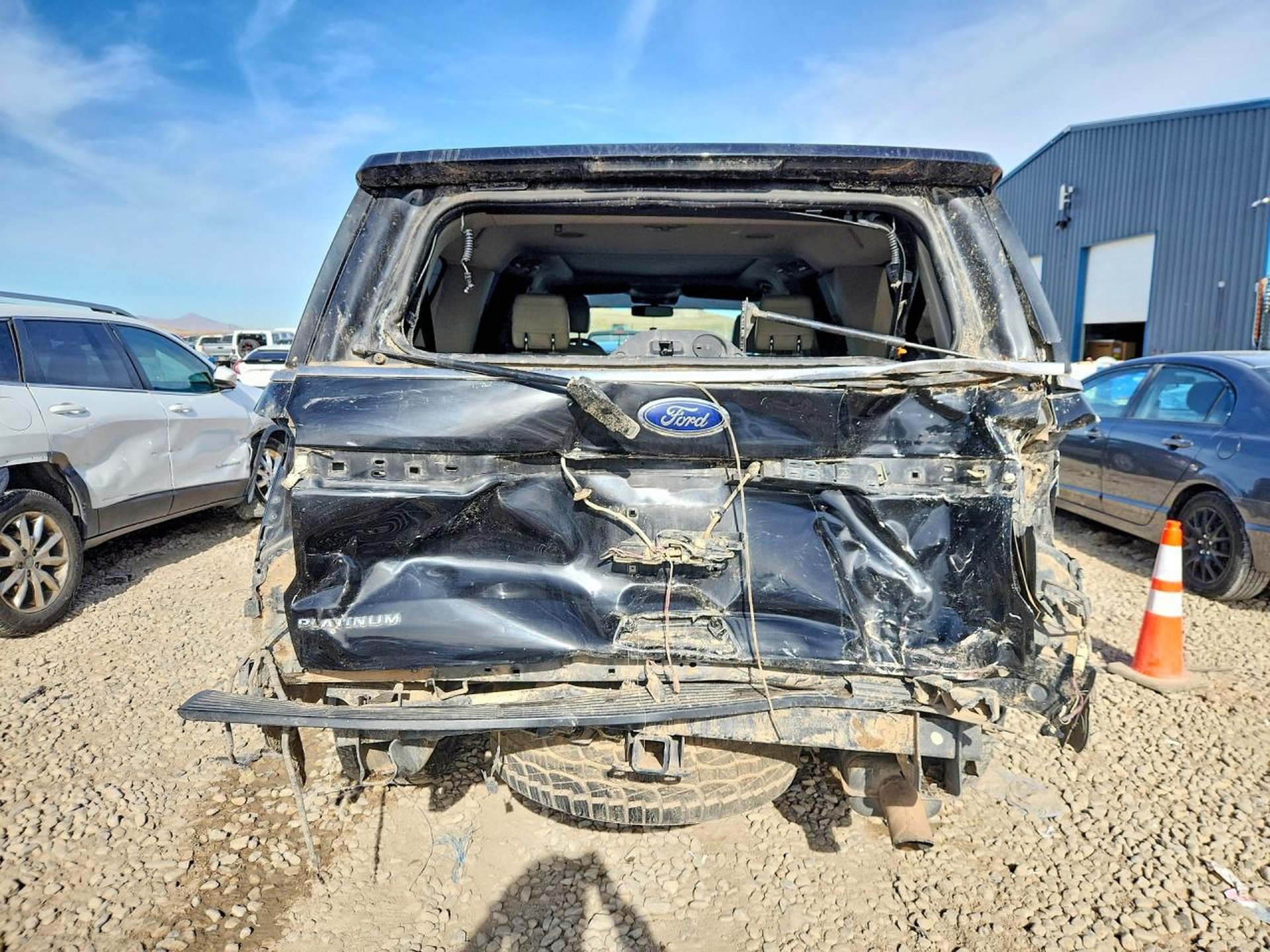 Black Ford Expedition with severe rear collision damage