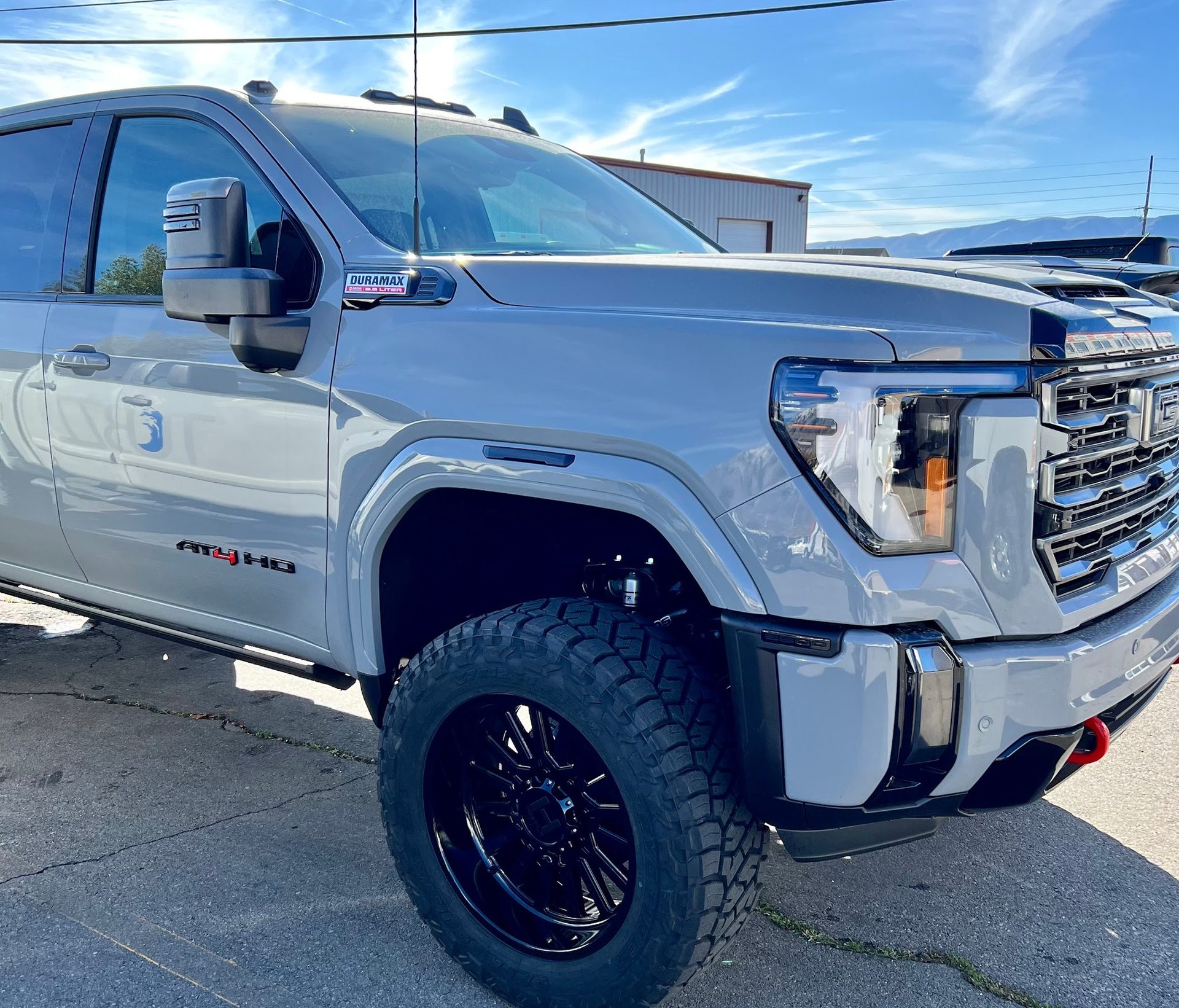Grey GMC AT4 HD after mechanical and accessory work