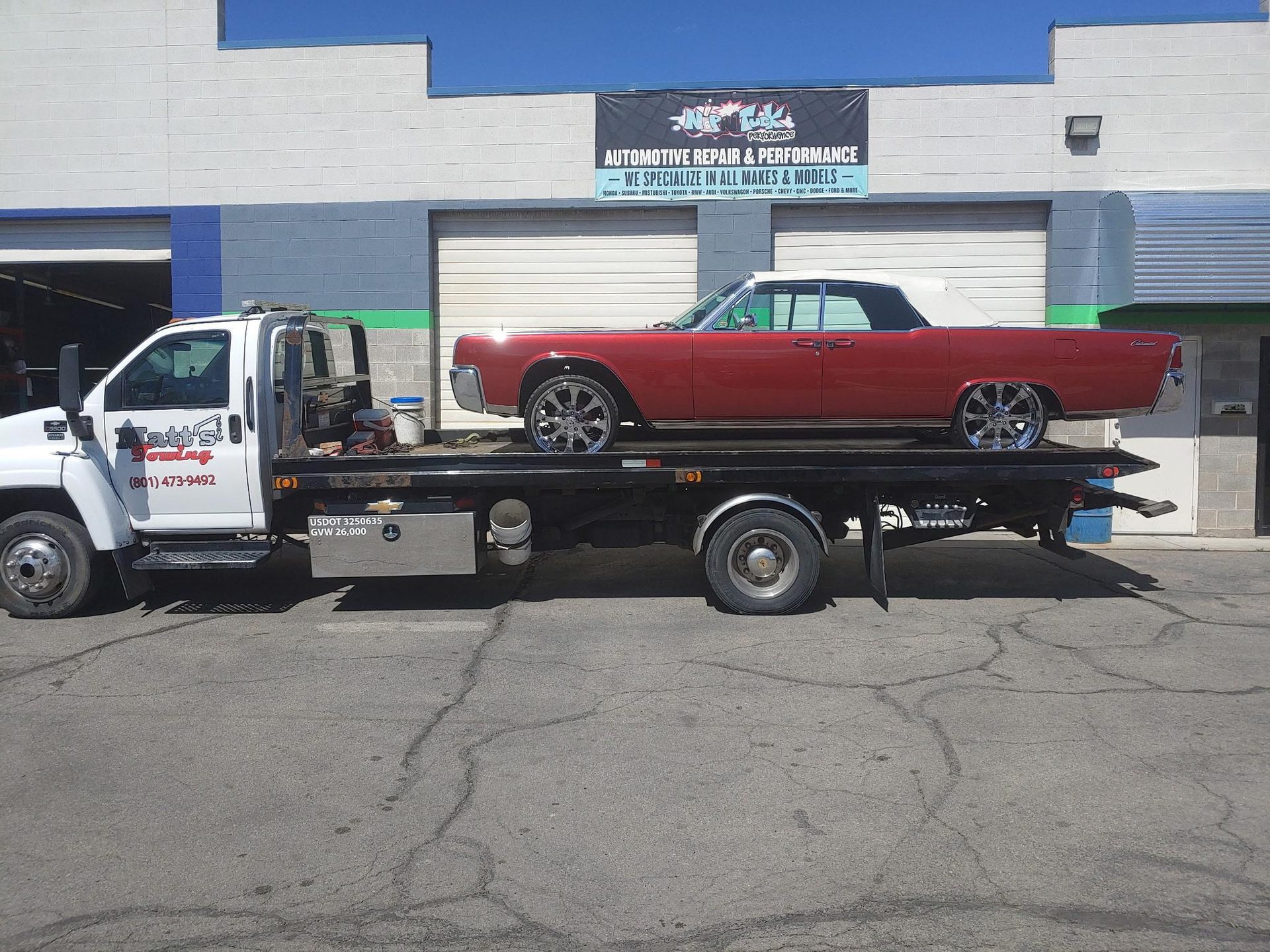 Classic red Lincoln on an Apex Collision flatbed